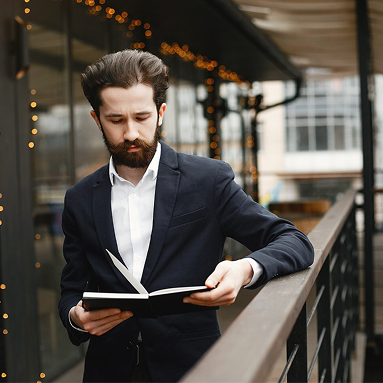 Man reading book in bookstore